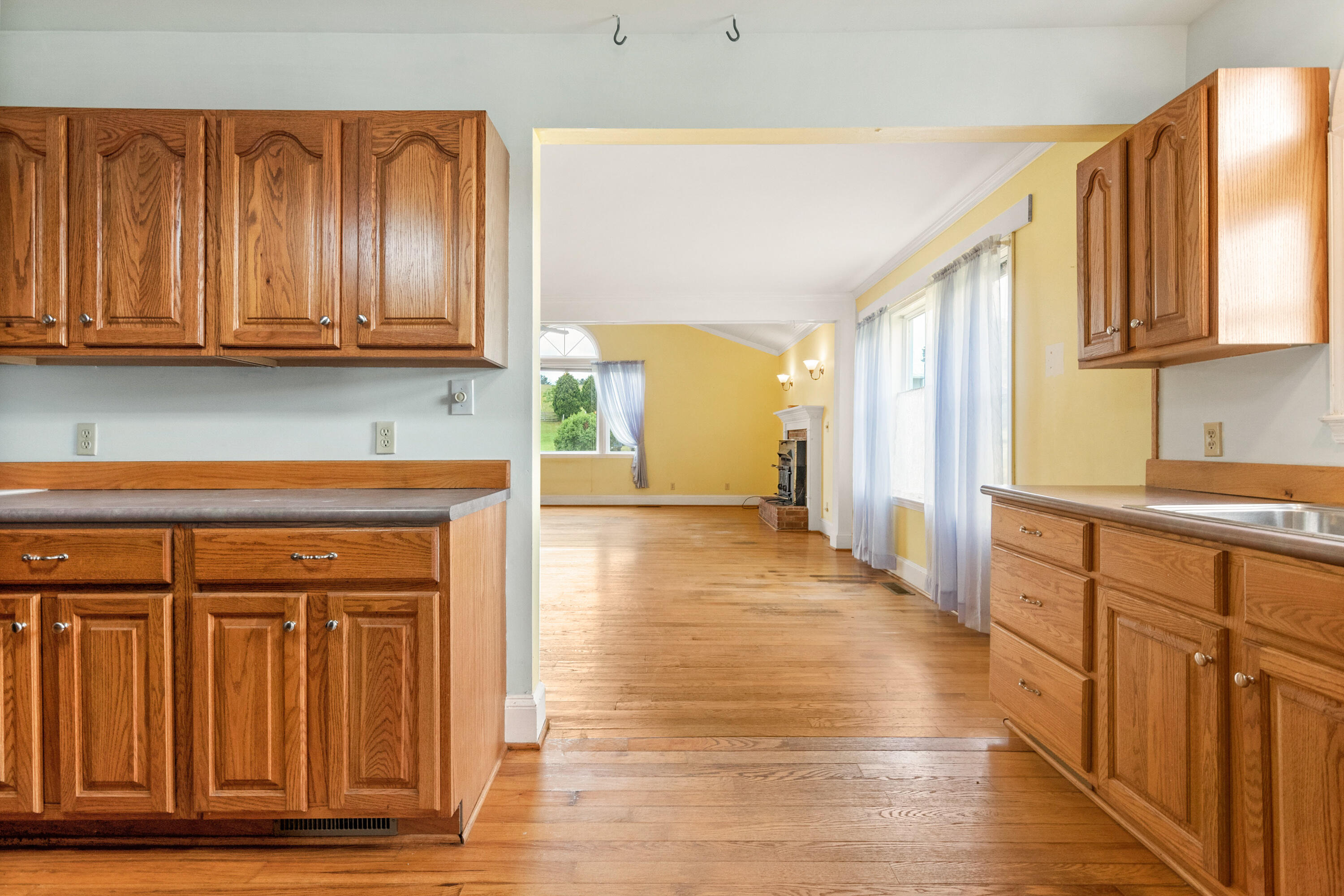 223 Conner Grove Road Southwest Willis, VA 24380 - Photo 16 of 74 a view of a kitchen with wooden floor and cabinets