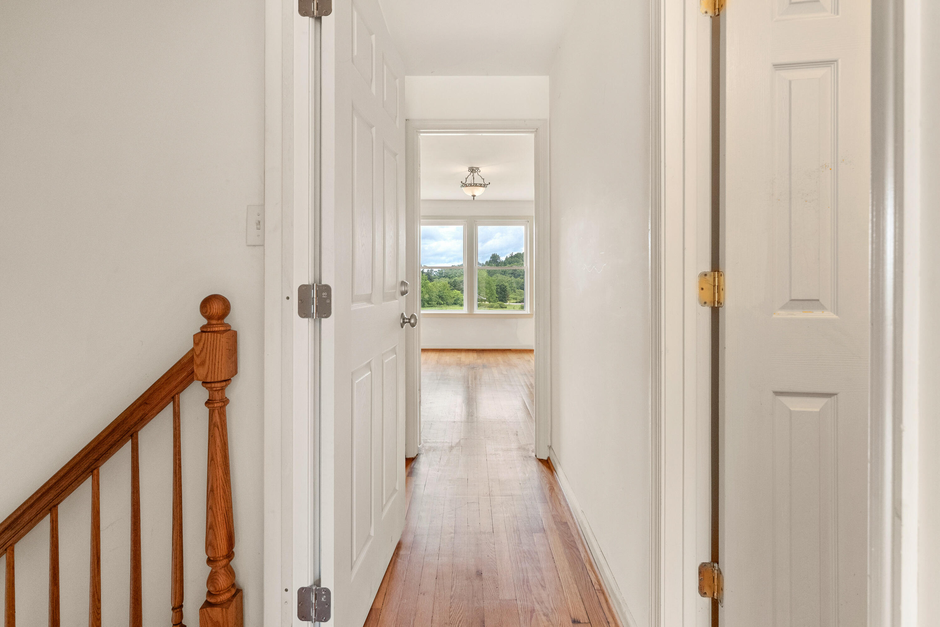 223 Conner Grove Road Southwest Willis, VA 24380 - Photo 36 of 74 a view of a hallway with wooden floor and staircase
