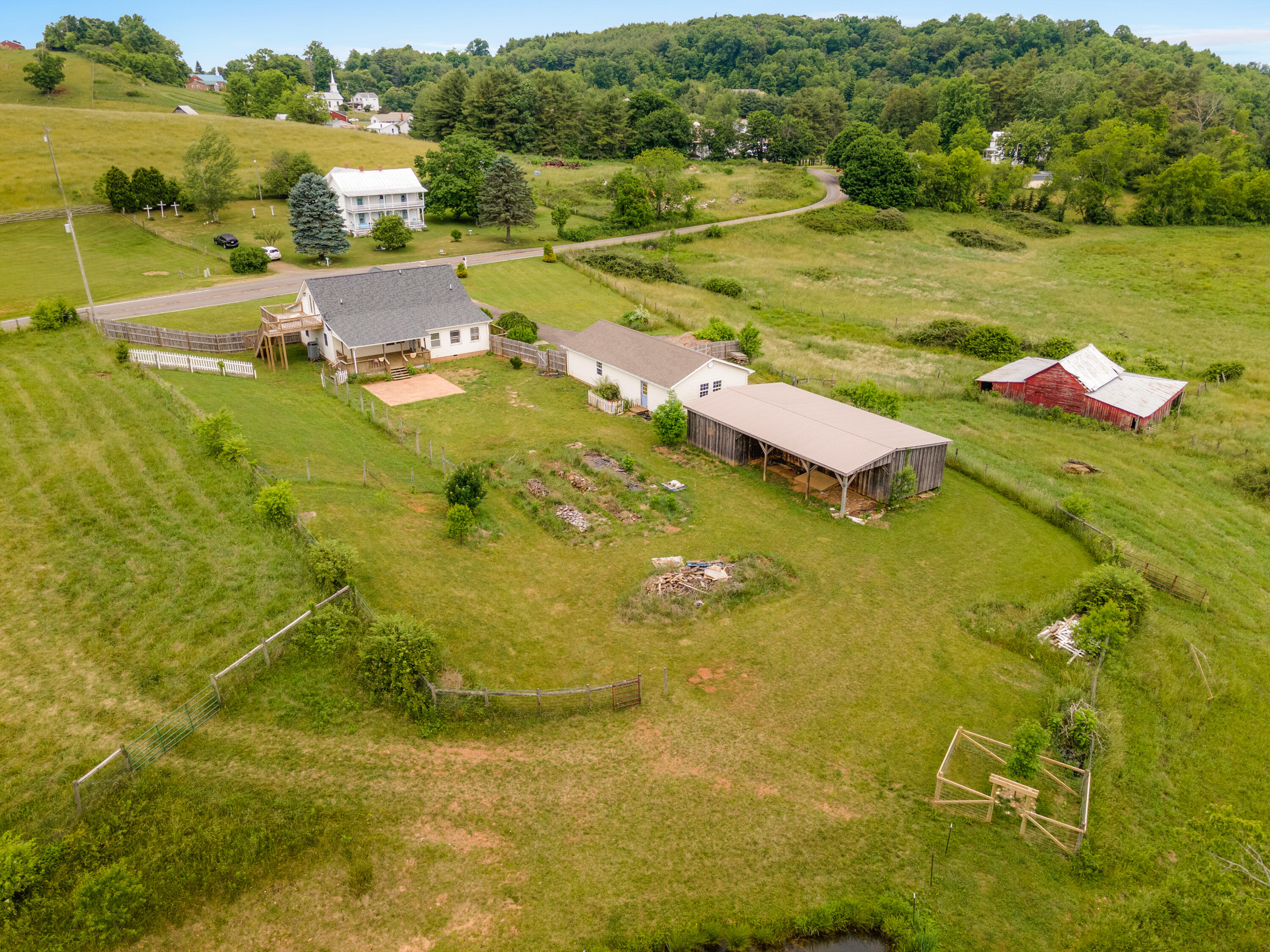 223 Conner Grove Road Southwest Willis, VA 24380 - Photo 49 of 74 a view of a lake with a houses