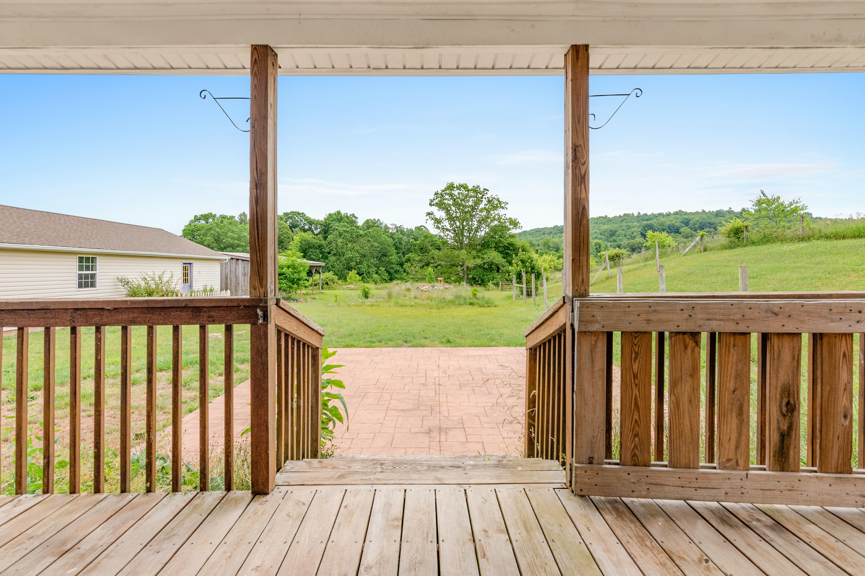 223 Conner Grove Road Southwest Willis, VA 24380 - Photo 60 of 74 a view of a wooden balcony with a yard