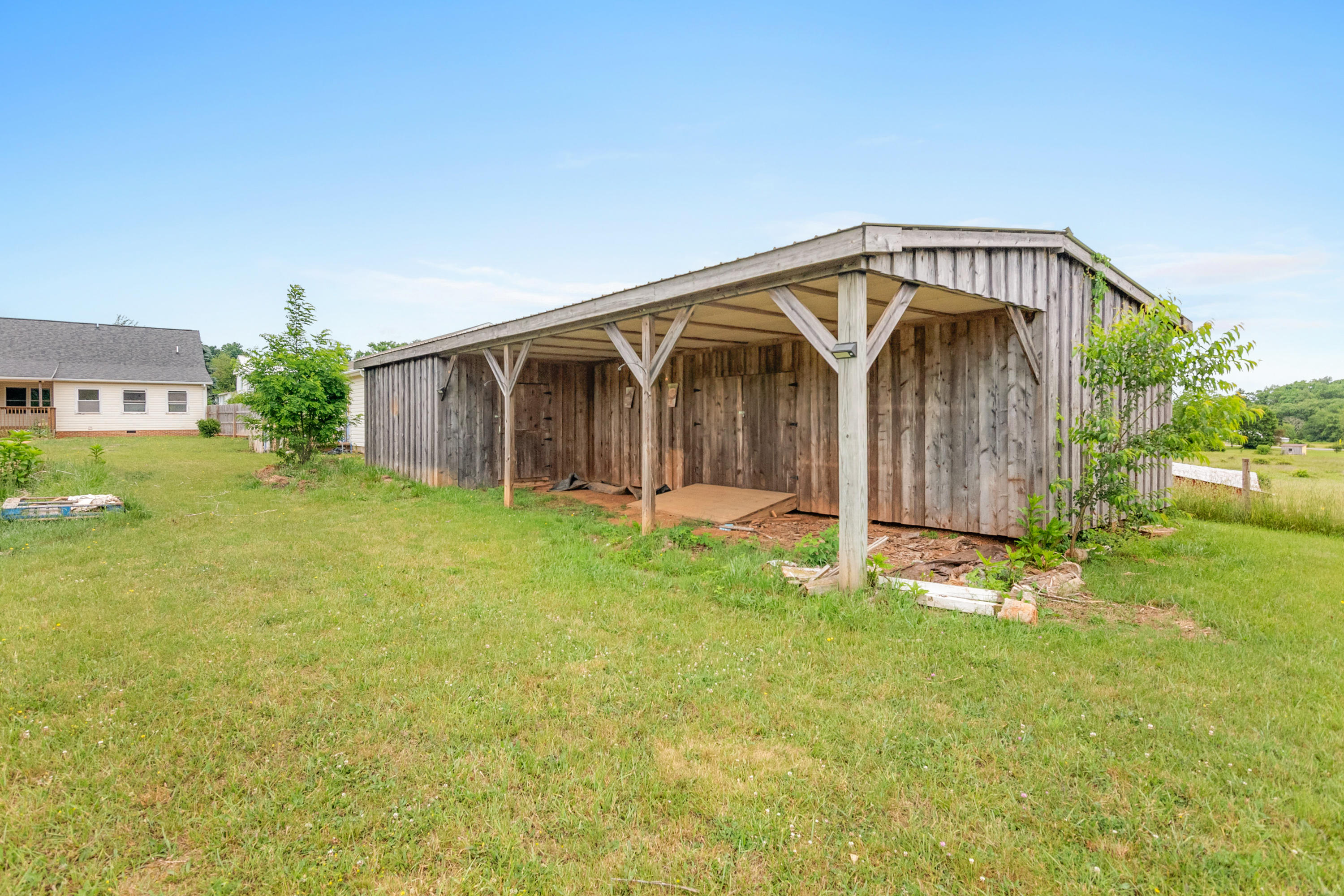 223 Conner Grove Road Southwest Willis, VA 24380 - Photo 64 of 74 a view of a house with backyard and garden