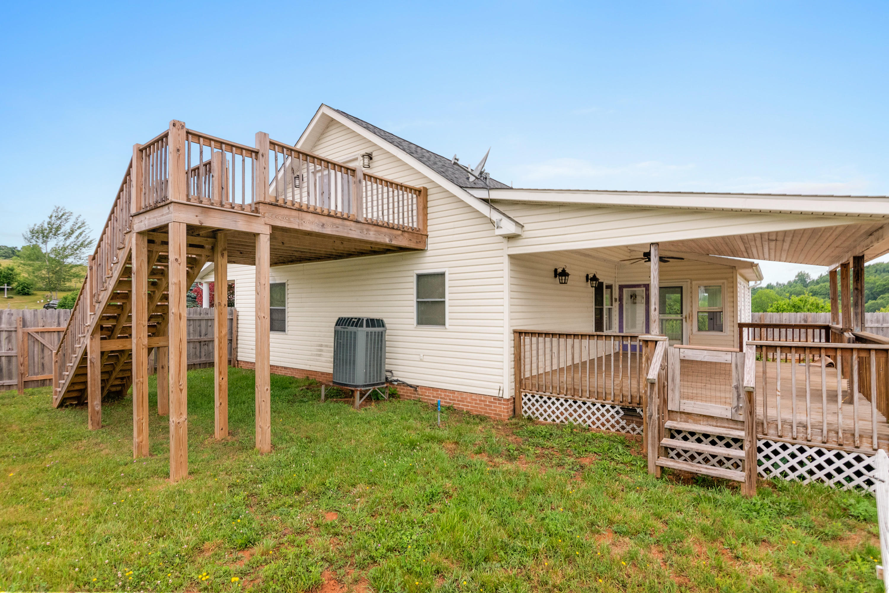 223 Conner Grove Road Southwest Willis, VA 24380 - Photo 69 of 74 a view of a house with a yard patio and a wooden deck