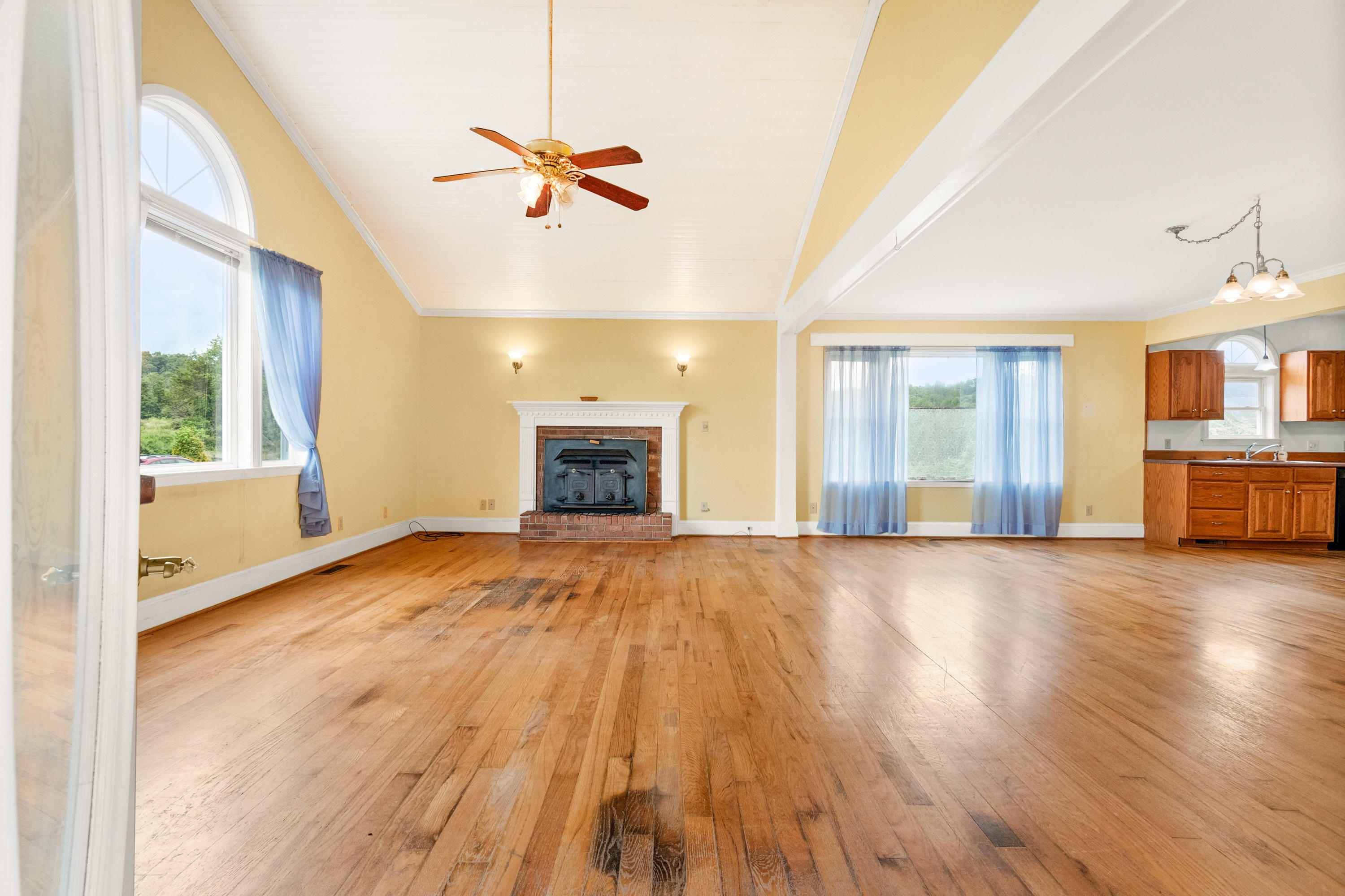 223 Conner Grove Road Southwest Willis, VA 24380 - Photo 8 of 74 a view of an empty room with window and wooden floor