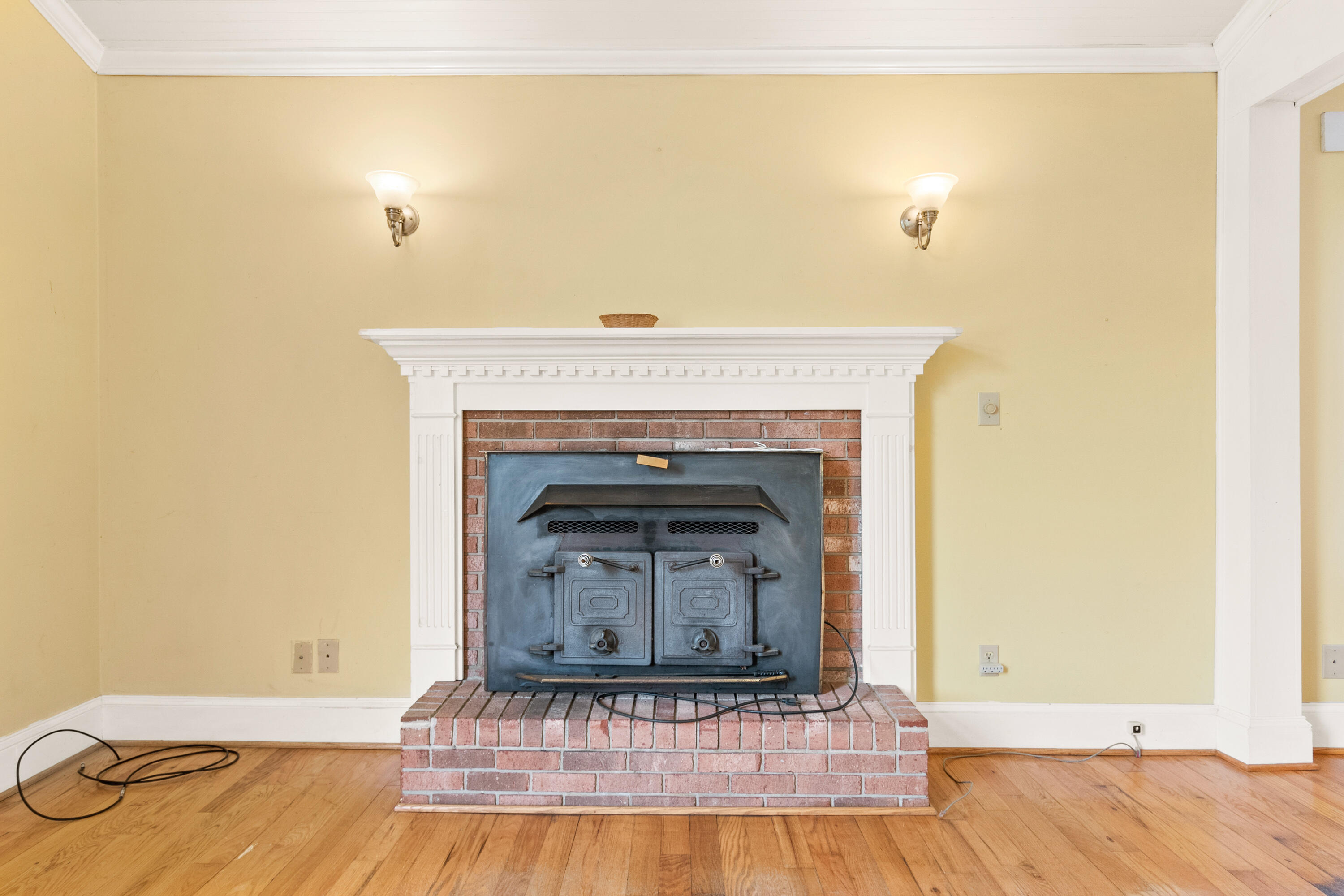 223 Conner Grove Road Southwest Willis, VA 24380 - Photo 10 of 74 a view of a fireplace with vanity and a wooden floor