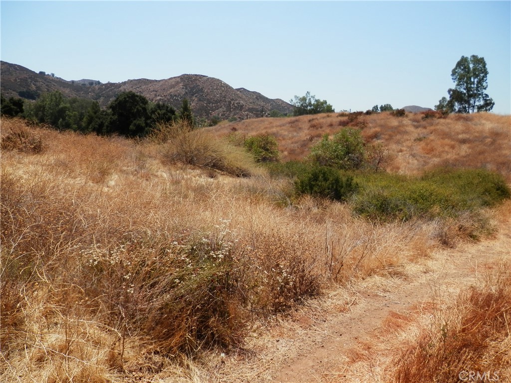 B Hemlock Street Wildomar, CA 92584 - Photo 12 of 17 a view of a lake with mountains in the background