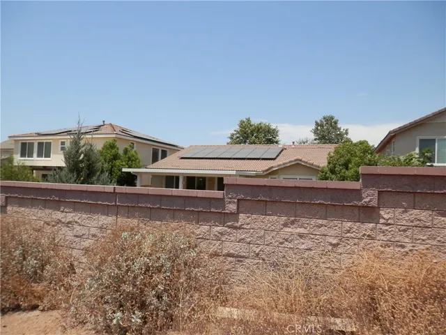 a house with trees in the background