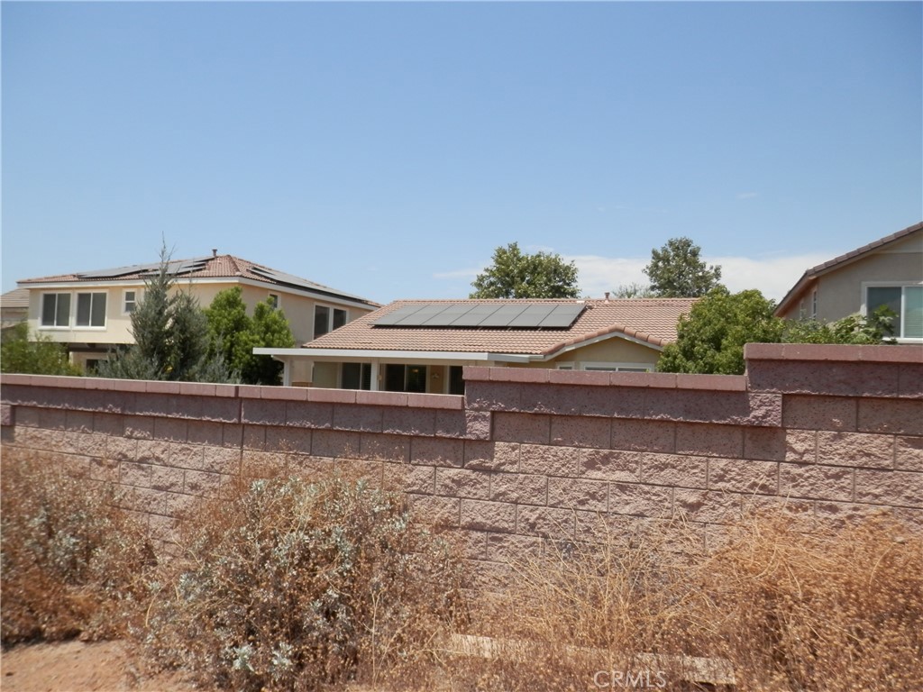 B Hemlock Street Wildomar, CA 92584 - Photo 4 of 17 a house with trees in the background