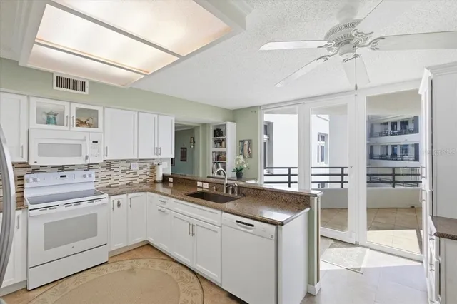 a bedroom with a bed and cabinets