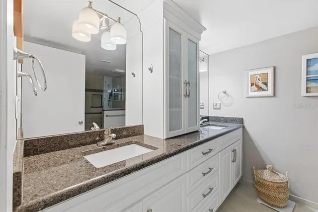 a bathroom with a shower and a sink