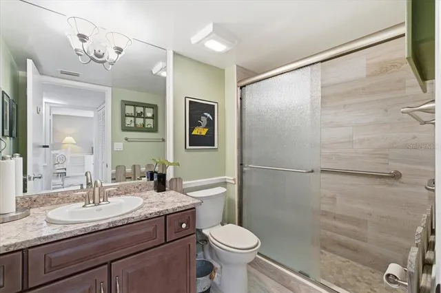 a bedroom with a bed and a lamp