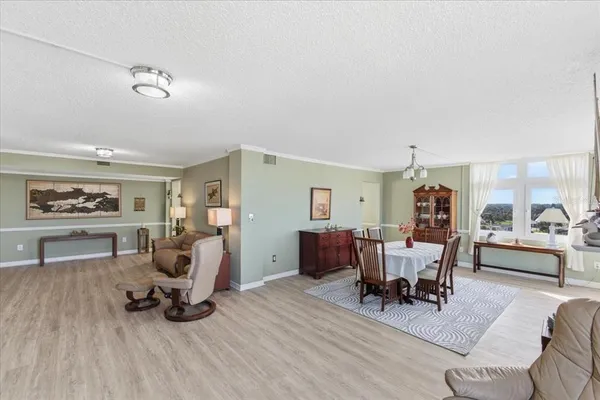 a view of a dining room with furniture window and outside view