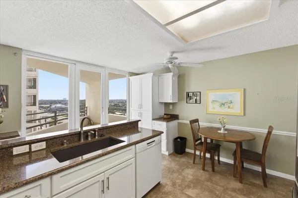 a kitchen with stainless steel appliances a refrigerator sink and stove