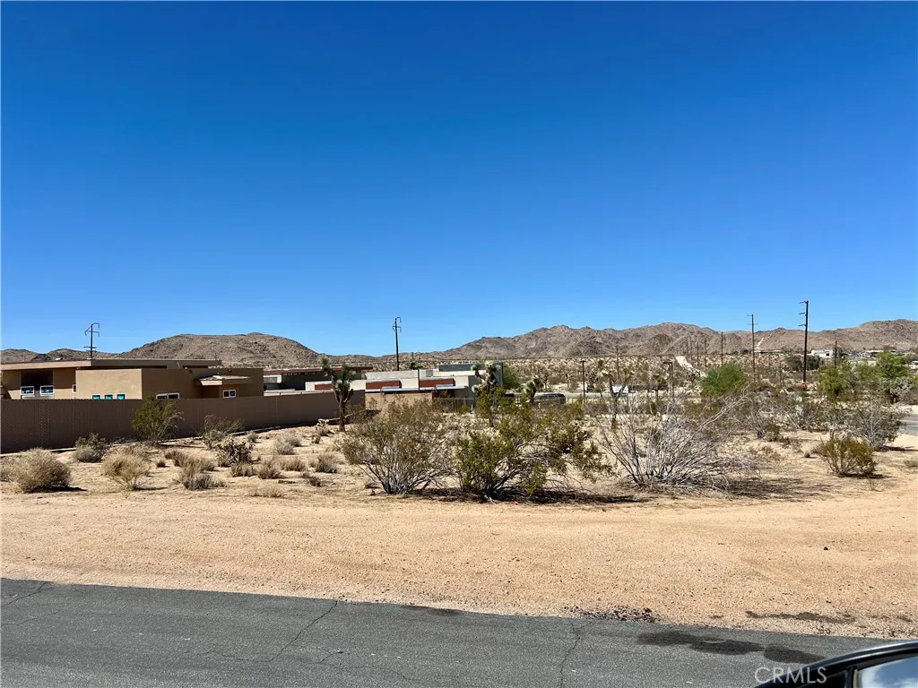 0 Division Street Joshua Tree, CA 92252 - Photo 5 of 10 a view of a ocean with mountains in the background