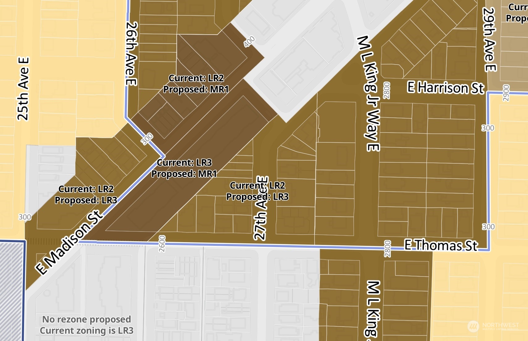 2602 East Thomas Street Seattle, WA 98112 - Photo 4 of 10 a blue sign that is on the side of a building