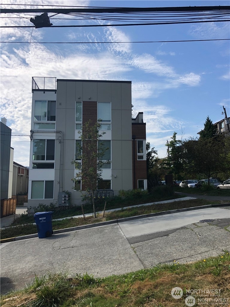 2602 East Thomas Street Seattle, WA 98112 - Photo 7 of 10 a view of a house with a yard