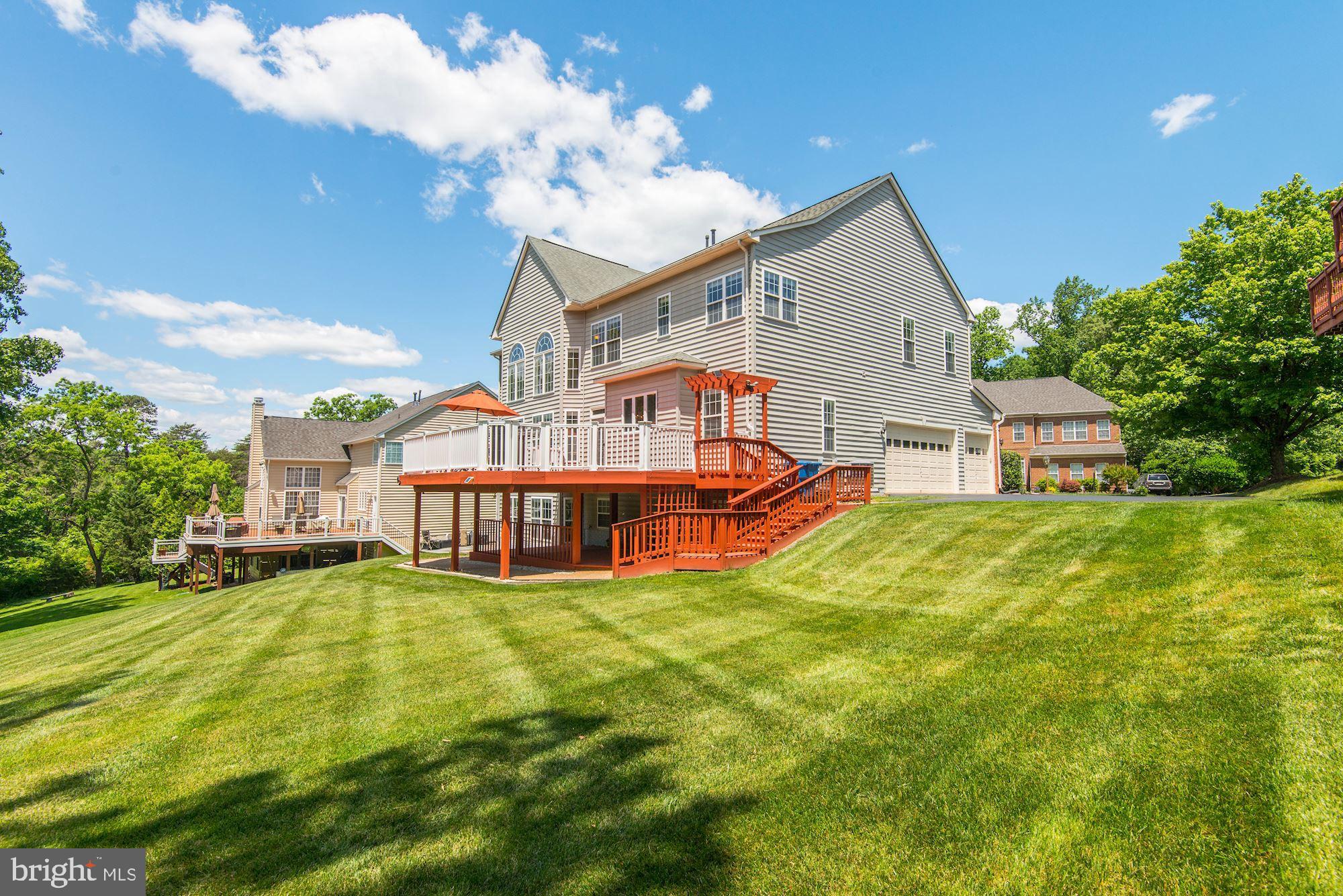 7104 Ayers Meadow Lane Springfield, VA 22150 - Photo 2 of 62 a view of a house with a big yard and large trees