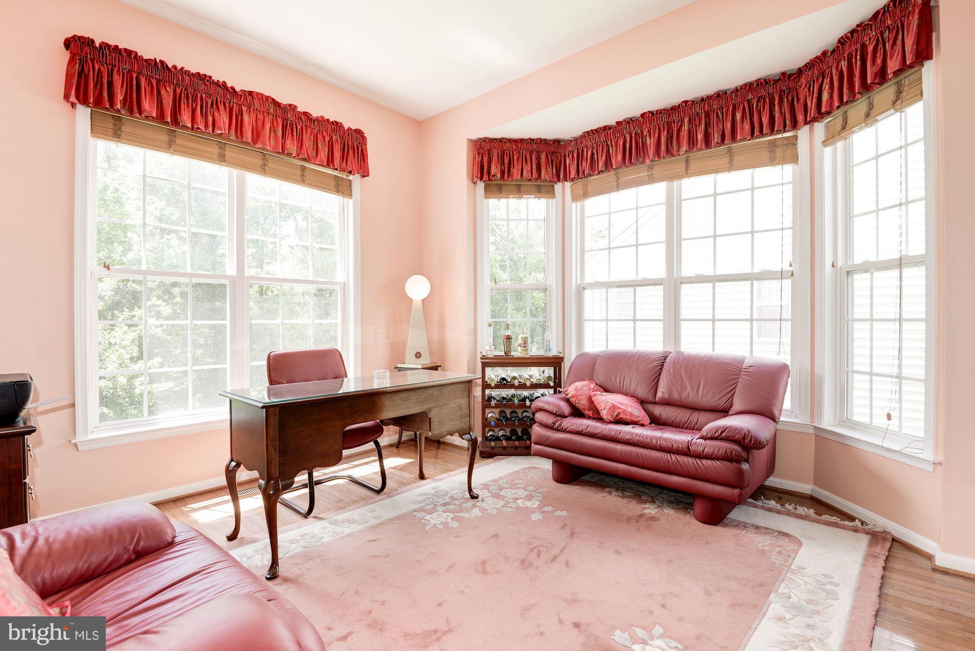 7104 Ayers Meadow Lane Springfield, VA 22150 - Photo 13 of 62 a living room with furniture and a window