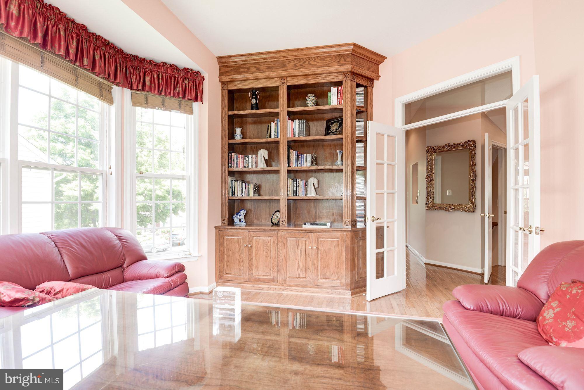 7104 Ayers Meadow Lane Springfield, VA 22150 - Photo 14 of 62 a living room with furniture and a large window