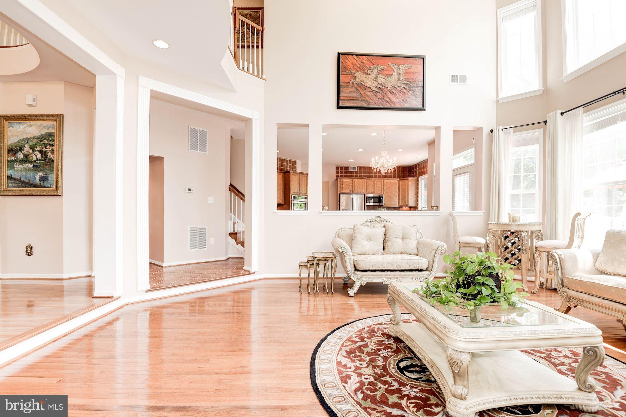 7104 Ayers Meadow Lane Springfield, VA 22150 - Photo 18 of 62 a living room with furniture and a large window
