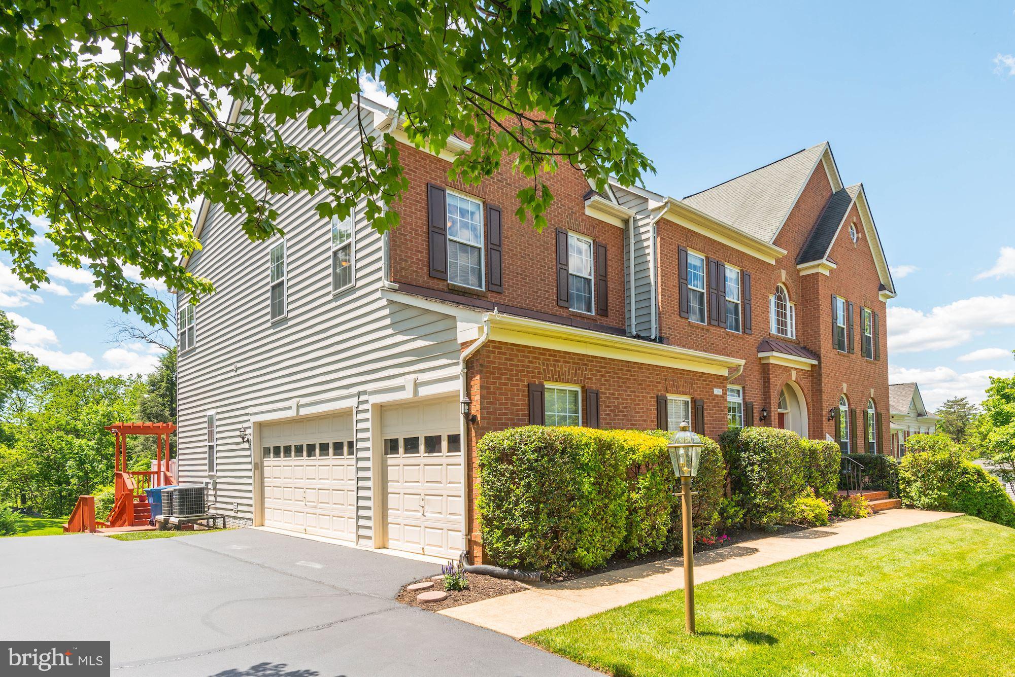 7104 Ayers Meadow Lane Springfield, VA 22150 - Photo 3 of 62 a front view of a house with a garden