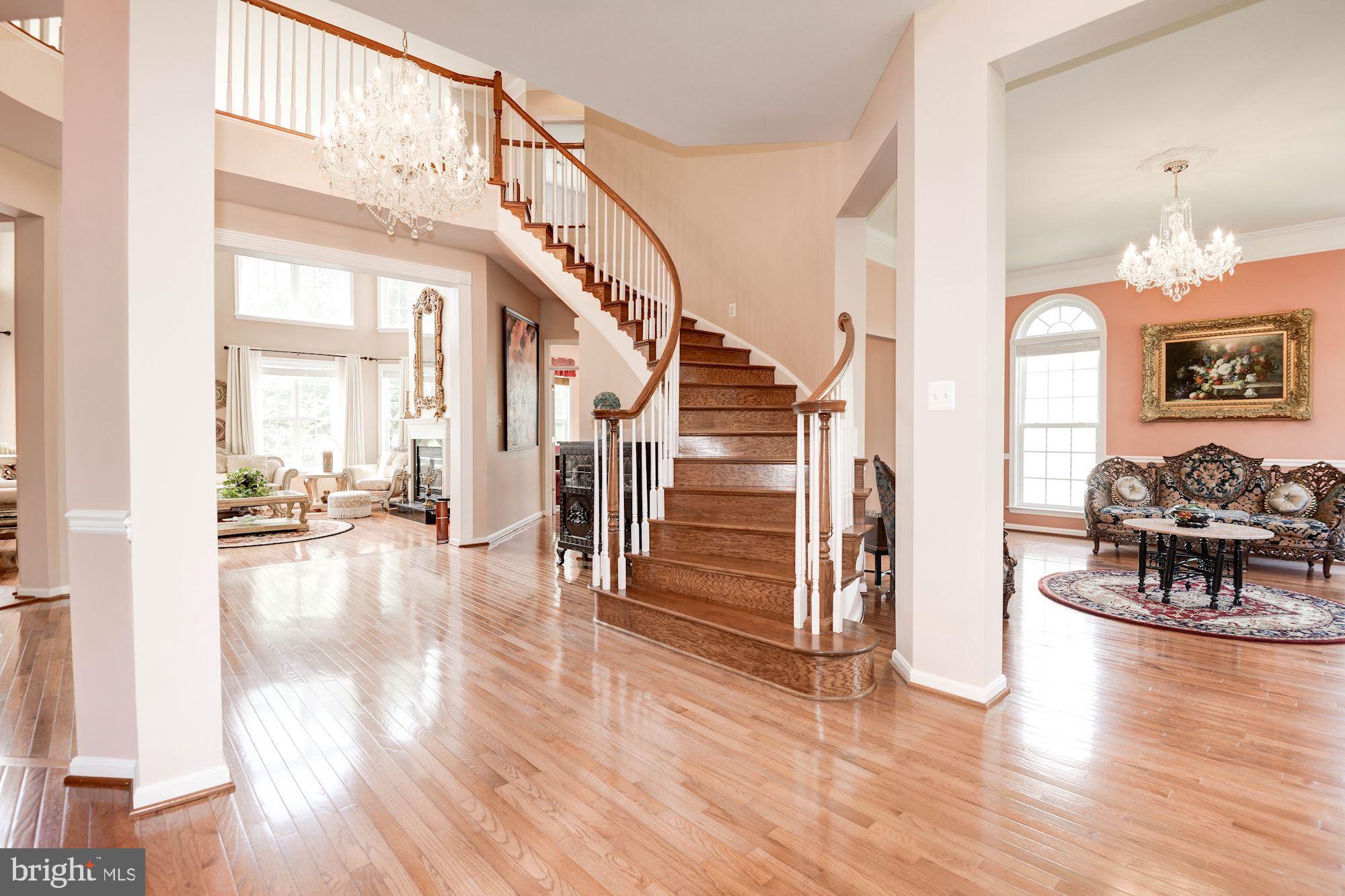 7104 Ayers Meadow Lane Springfield, VA 22150 - Photo 4 of 62 a view of empty room with wooden floor and furniture