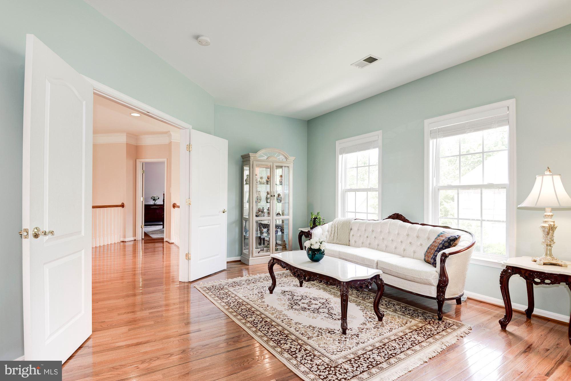 7104 Ayers Meadow Lane Springfield, VA 22150 - Photo 32 of 62 a living room with furniture and a wooden floor