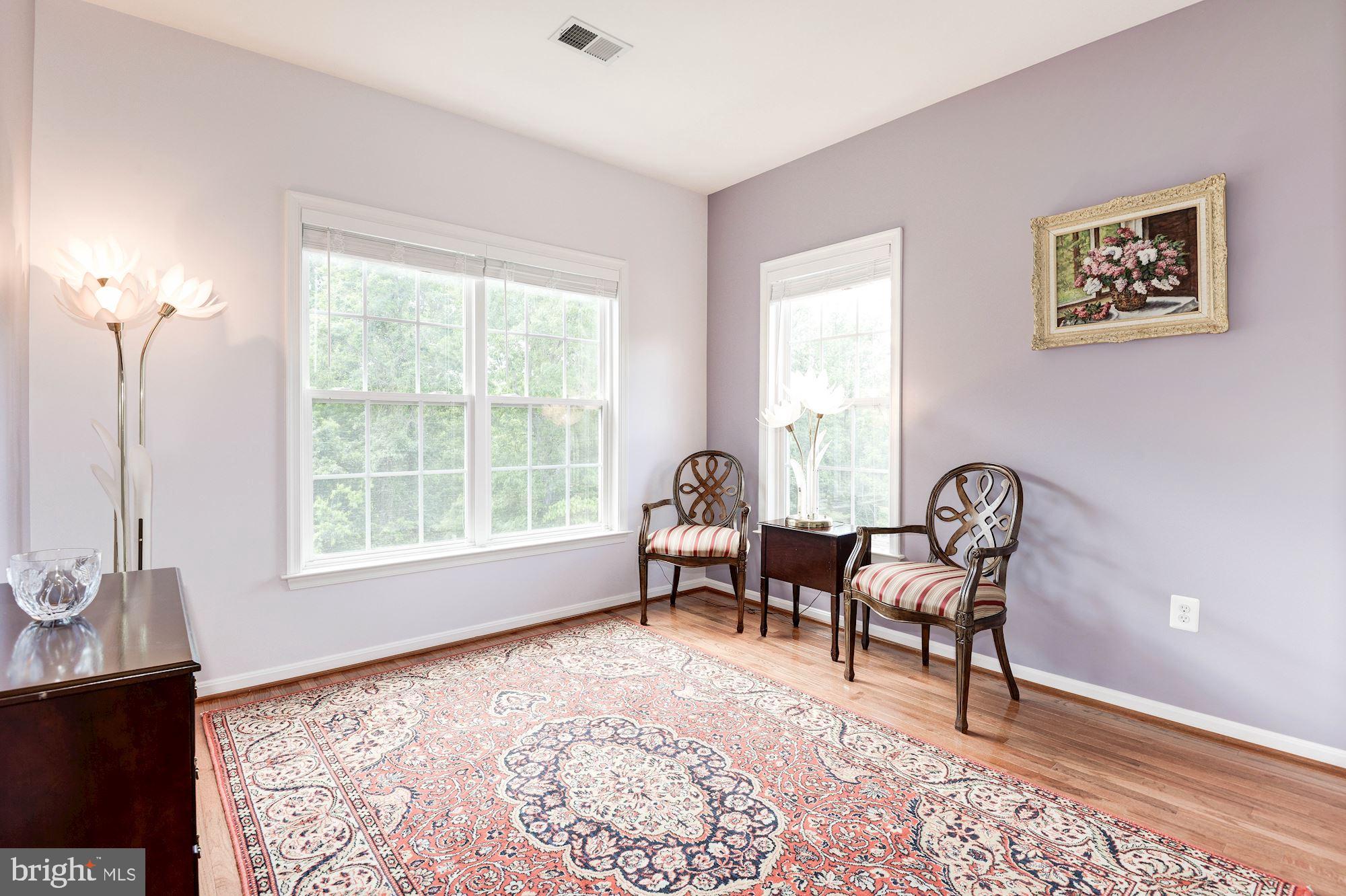 7104 Ayers Meadow Lane Springfield, VA 22150 - Photo 43 of 62 a living room with furniture and a window