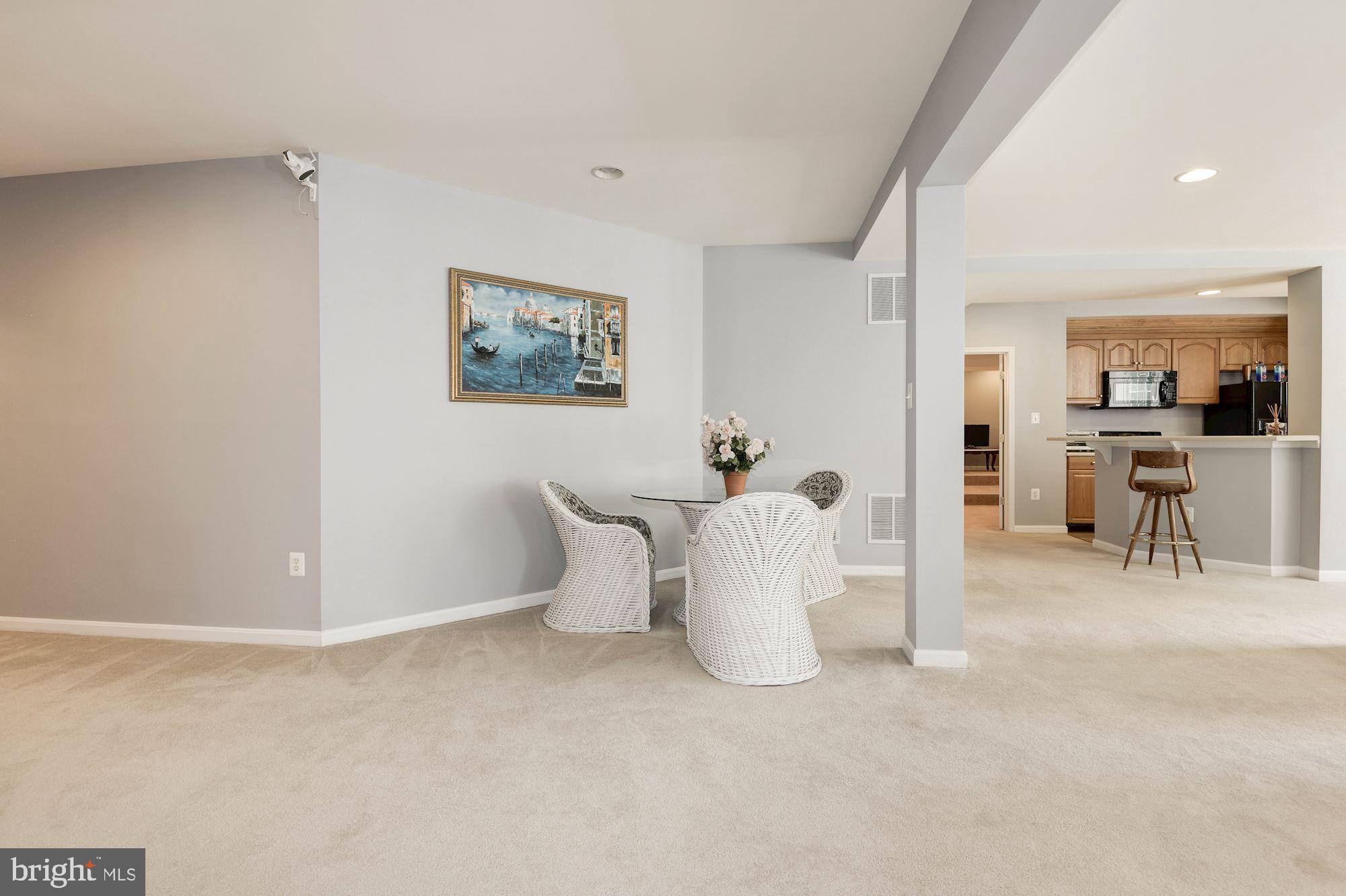 7104 Ayers Meadow Lane Springfield, VA 22150 - Photo 44 of 62 a view of a dining room with furniture and a potted plant