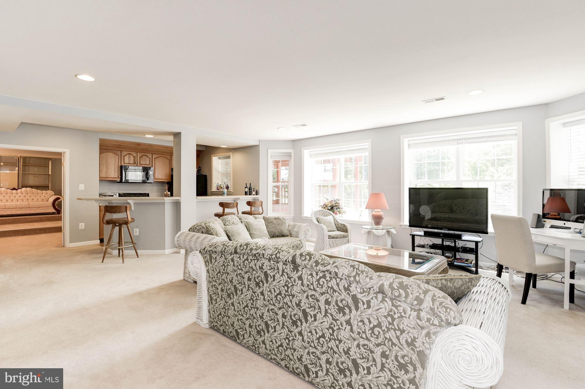 7104 Ayers Meadow Lane Springfield, VA 22150 - Photo 46 of 62 a living room with furniture and a flat screen tv