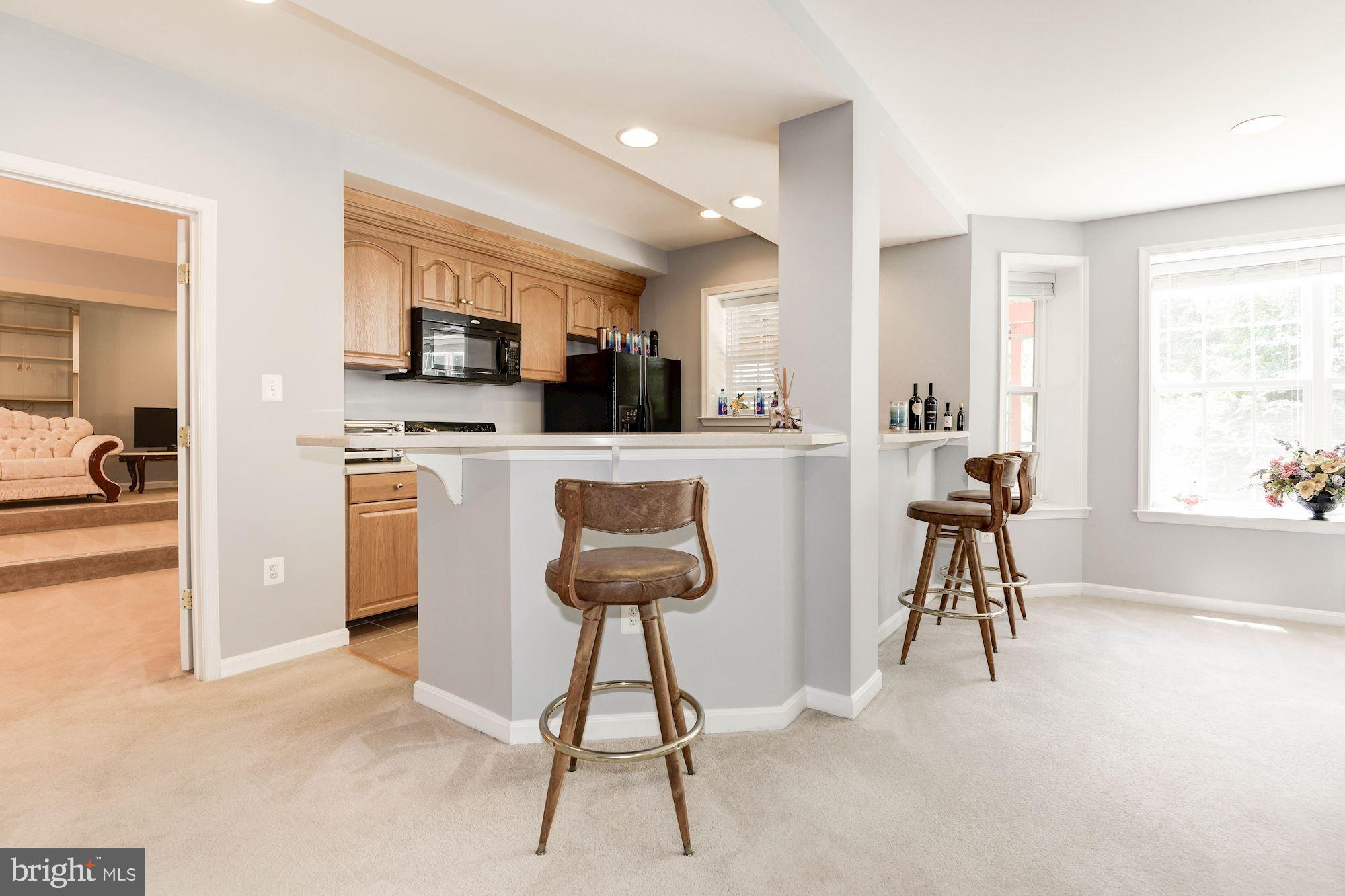7104 Ayers Meadow Lane Springfield, VA 22150 - Photo 47 of 62 a living room with furniture a fireplace and a flat screen tv