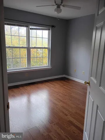 a view of an empty room and a window