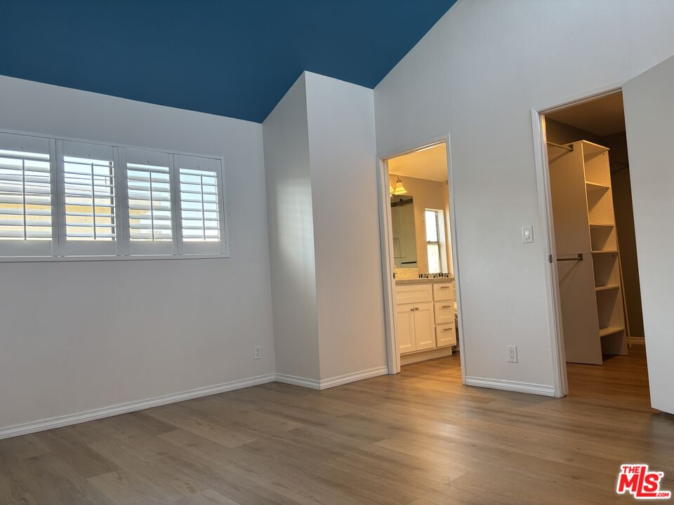 557 East Verdugo Avenue, Unit C Burbank, CA 91501 - Photo 1 of 14 an empty room with wooden floor and a window
