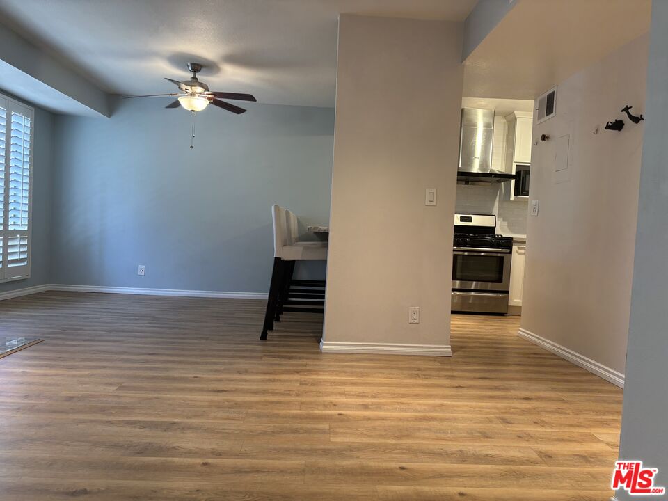 557 East Verdugo Avenue, Unit C Burbank, CA 91501 - Photo 12 of 14 wooden floor in an empty room with a window
