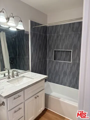 a bathroom with a sink a vanity and a mirror
