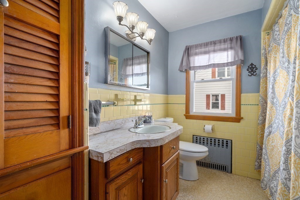 45 Ruggles Street Three Rivers, MA 01080 - Photo 14 of 29 a bathroom with a granite countertop sink mirror and toilet