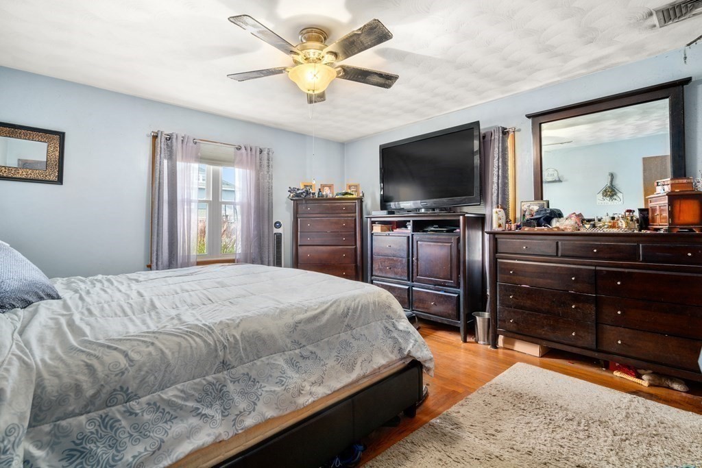 45 Ruggles Street Three Rivers, MA 01080 - Photo 17 of 29 a bedroom with a bed and a flat screen tv