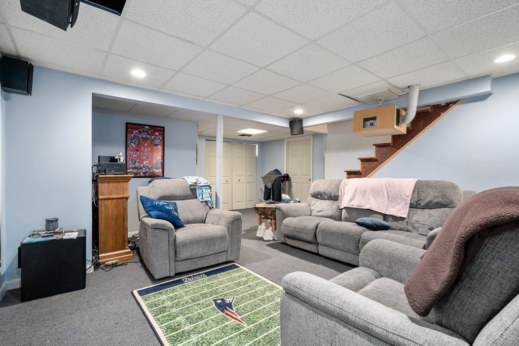 45 Ruggles Street Three Rivers, MA 01080 - Photo 19 of 29 a living room with furniture and a rug