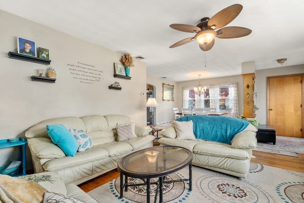 45 Ruggles Street Three Rivers, MA 01080 - Photo 8 of 29 a living room with furniture kitchen view and a chandelier