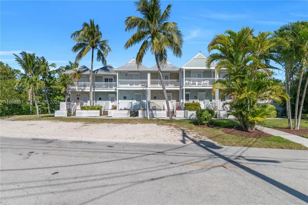 a view of a swimming pool with palm trees