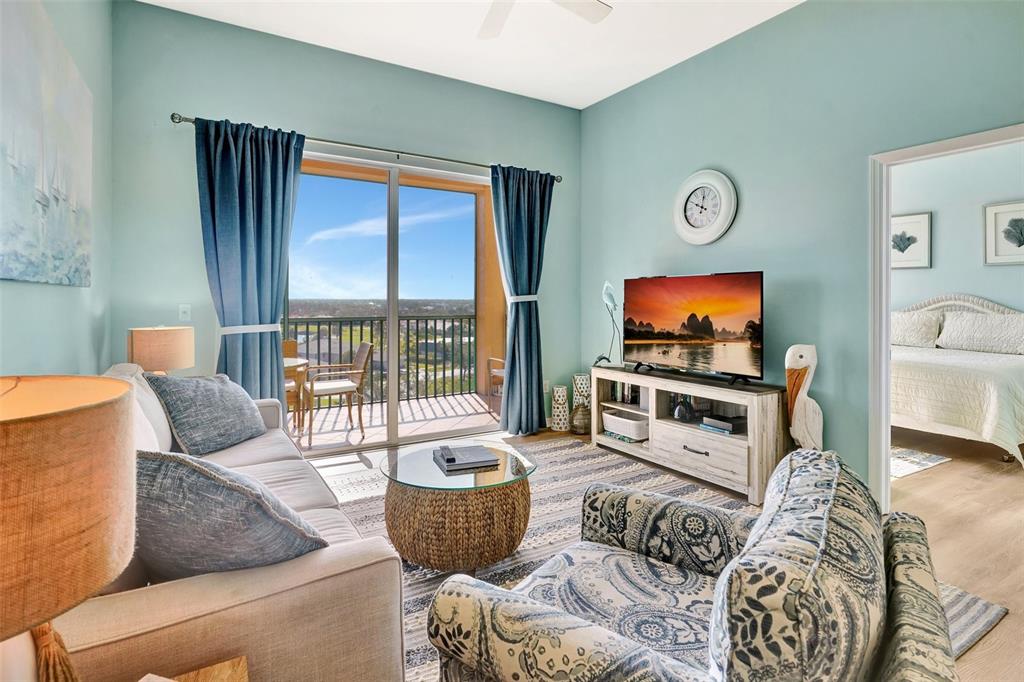 2090 Matecumbe Key Road, Unit 1708 Punta Gorda, FL 33955 - Photo 11 of 34 a living room with furniture and a flat screen tv