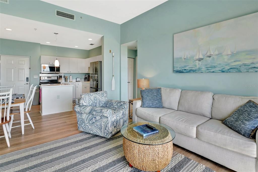 2090 Matecumbe Key Road, Unit 1708 Punta Gorda, FL 33955 - Photo 12 of 34 a living room with furniture and a wooden floor