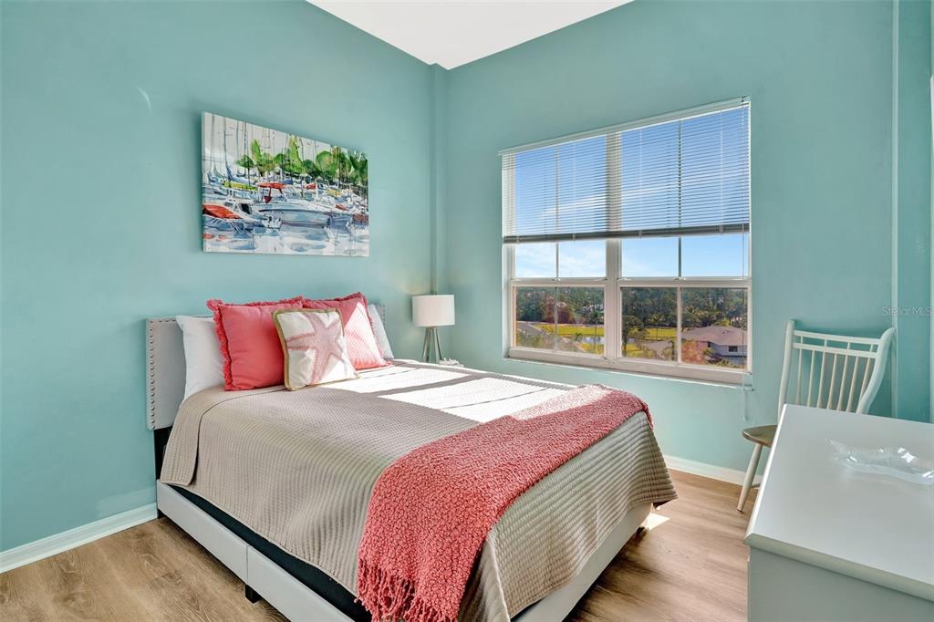 2090 Matecumbe Key Road, Unit 1708 Punta Gorda, FL 33955 - Photo 16 of 34 a bedroom with a bed and a large window