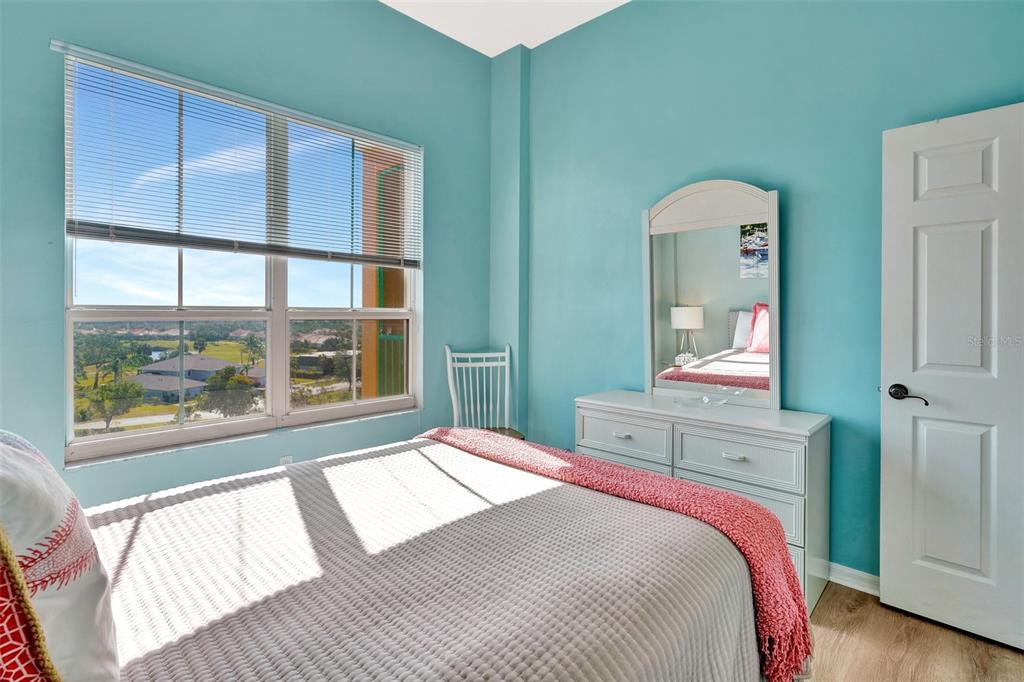 2090 Matecumbe Key Road, Unit 1708 Punta Gorda, FL 33955 - Photo 17 of 34 a bedroom with a bed and a large window