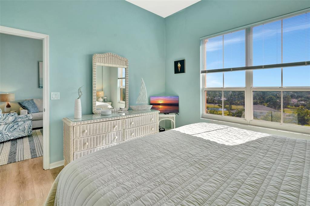 2090 Matecumbe Key Road, Unit 1708 Punta Gorda, FL 33955 - Photo 22 of 34 a bedroom with a bed and a large window