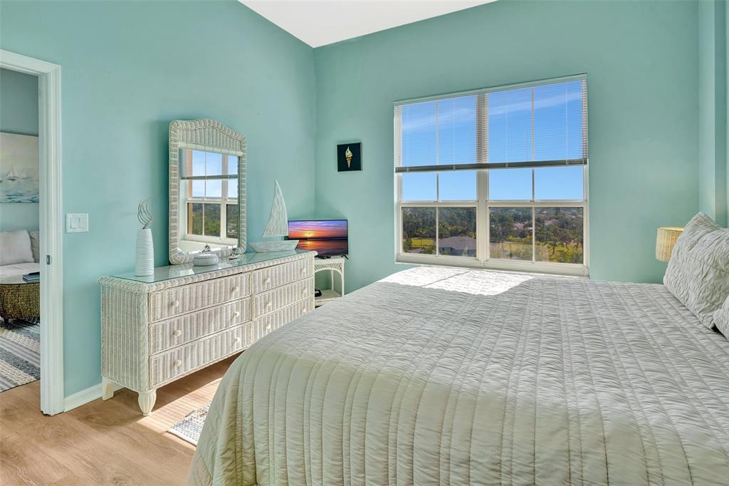 2090 Matecumbe Key Road, Unit 1708 Punta Gorda, FL 33955 - Photo 26 of 34 a bed sitting in a bedroom next to a window