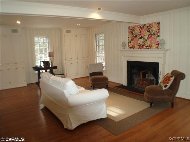 10329 Cherokee Road Richmond, VA 23235 - Photo 3 of 12 a living room with furniture and a fireplace