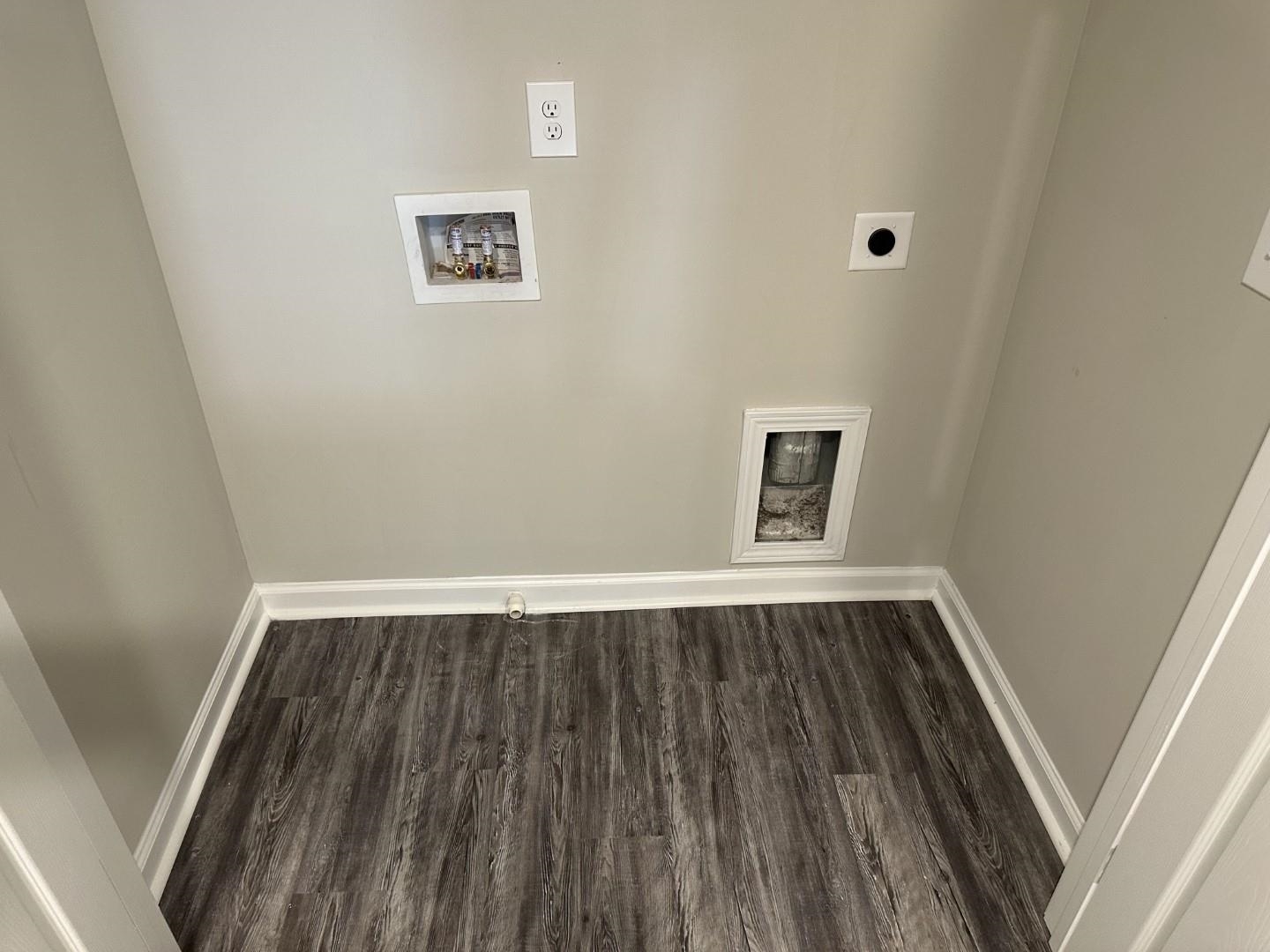 712 Keeshono St Union, Unit 712 Union City, GA 30291 - Photo 12 of 22 a view of an empty room with wooden floor and a window