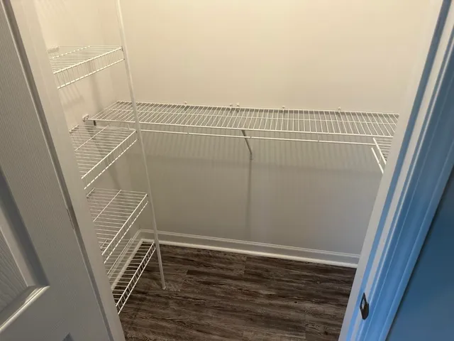 a view of a room with racks on the wall