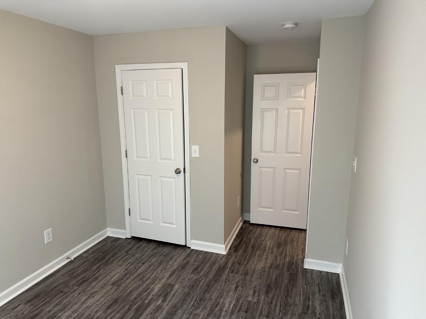 712 Keeshono St Union, Unit 712 Union City, GA 30291 - Photo 20 of 22 an empty room with wooden floor and closet