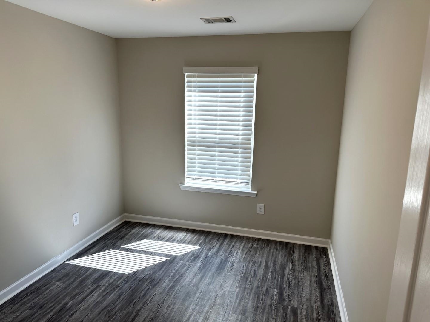 712 Keeshono St Union, Unit 712 Union City, GA 30291 - Photo 21 of 22 a view of a room with wooden floor and window